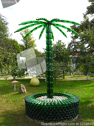 Image of Palm tree made of bottles from a champagne