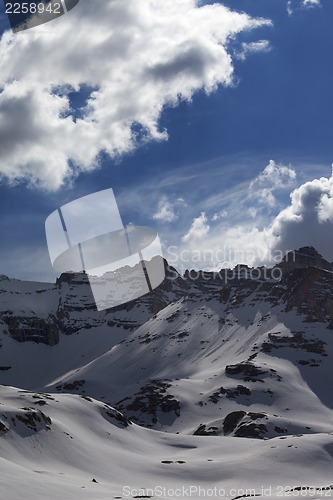 Image of Snow mountains and blue sky with clouds