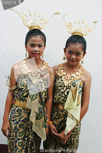 Image of Girls in bright traditional costume during a parade in Phuket, T