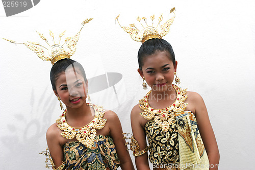 Image of Happy girls in bright traditional dress during a parade in Phuke