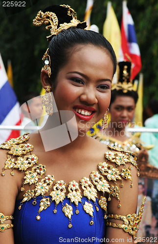 Image of Thai female in bright traditional dress during a festival in Phu