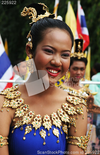 Image of Thai female in bright traditional dress during a festival in Phu