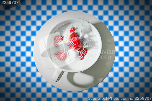 Image of cup with strawberry splash