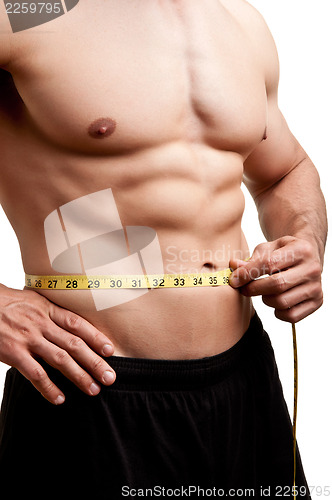 Image of Fit Man Measuring His Waist