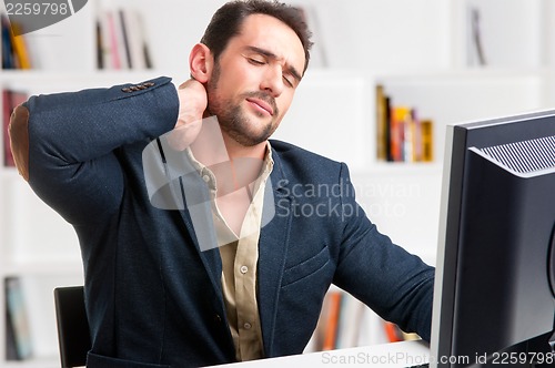Image of Casual Businessman With Pain In His Neck