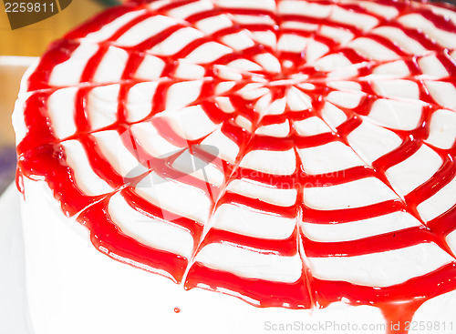 Image of Fresh whipped cream cake decorated rasberry sauce 