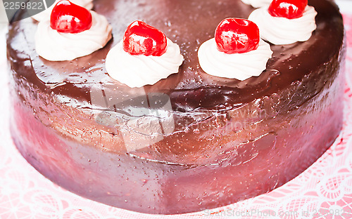 Image of Fresh bake chocolate cake with cherry and whipped cream 