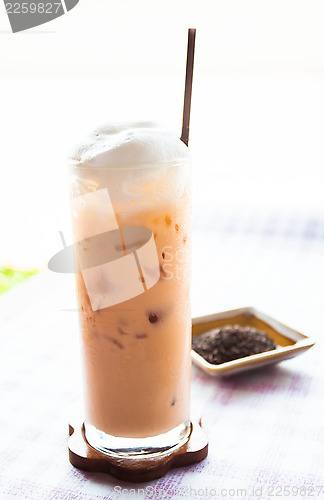 Image of A glass of cold thai milk tea 