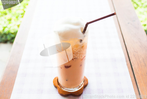Image of Fresh glass of cold thai milk tea 