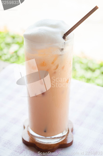 Image of A glass of iced thai milk tea 