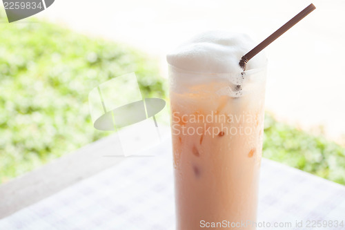 Image of Fresh glass of iced thai milk tea 