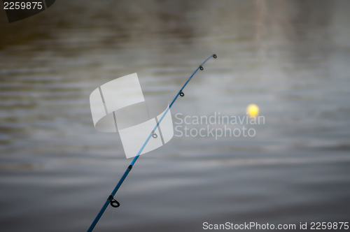 Image of Fishing Pole - bobber floating in lake