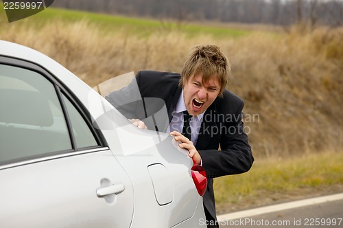 Image of Pushing car