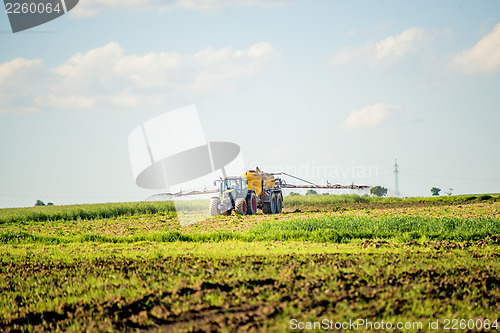 Image of tractor with dung trailer