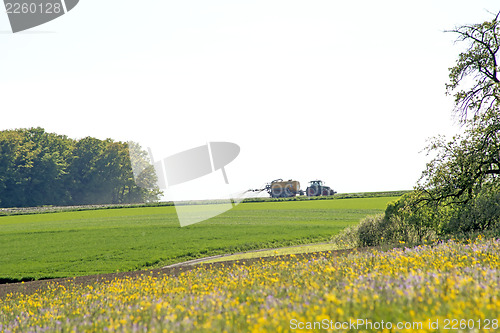 Image of tractor with dung trailer