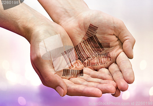 Image of hands with barcodes