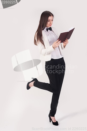 Image of portrait of playful business woman with organizer