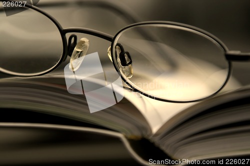 Image of Close up on the Glasses and the Magazine