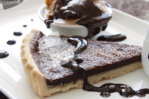 Image of Tart Slice With Chocolate Sauce