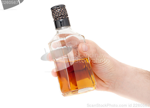 Image of Hand holding an bottle on white background, 