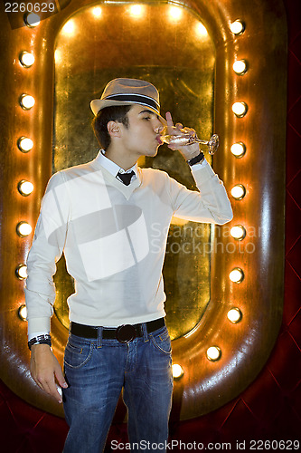 Image of Man with hat in night club