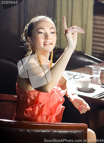 Image of woman at restaurant