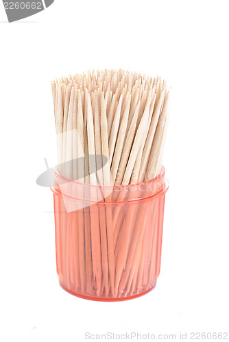 Image of bunch of toothpicks in a red  plastic container isolated on white background 