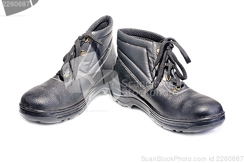 Image of Black working man's boots isolated on a white