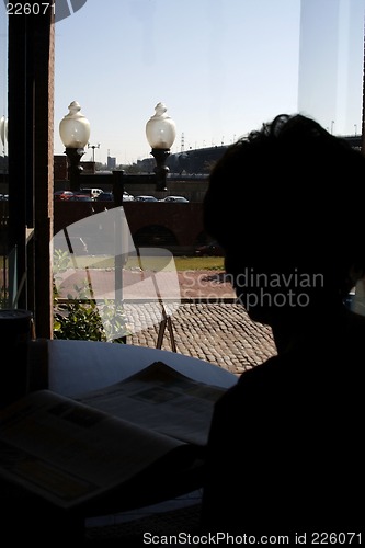 Image of Woman Silhouetter by the Windon in St. Louis