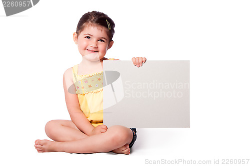 Image of Happy girl sitting with whiteboard