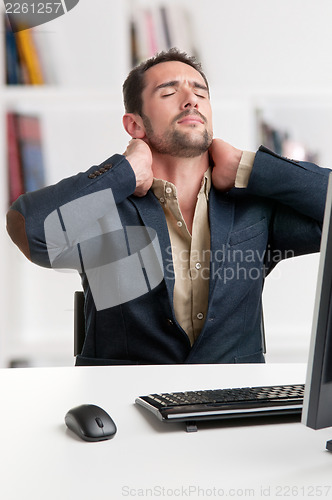 Image of Casual Businessman With Pain In His Neck