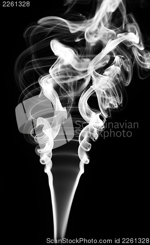 Image of Abstract white smoke swirls on black 