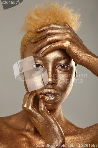 Image of Stunning African Amercian Woman Painted With Gold 