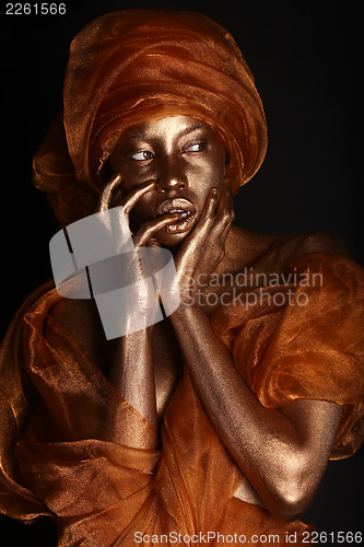 Image of Stunning African Amercian Woman Painted With Gold 