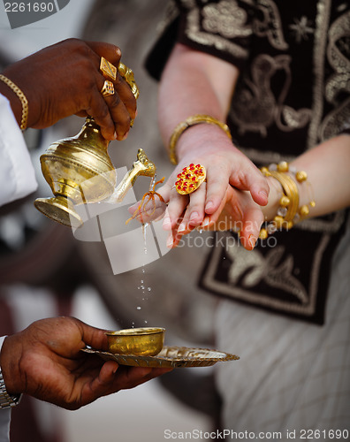 Image of Wedding in Sri Lanka - ritual watering fingers