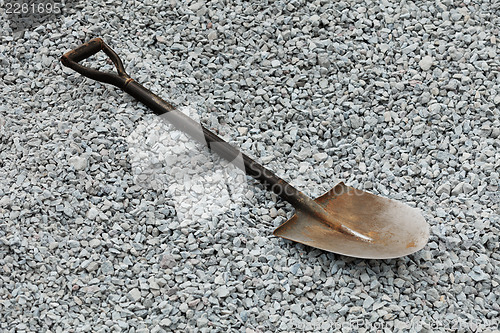 Image of Shovel on gray gravel