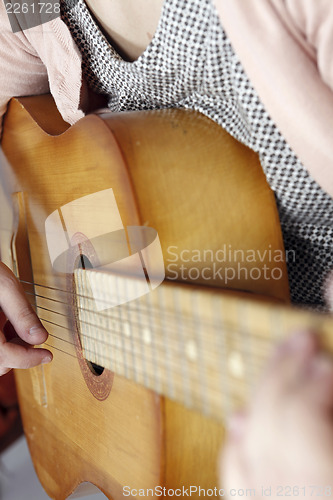 Image of Playing the guitar
