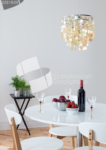 Image of Dining room decorated with beautiful chandelier