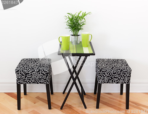 Image of Table for two with green cups