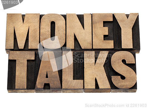 Image of money talks in wood type