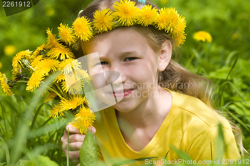 Image of girl in spring dandelion wreath