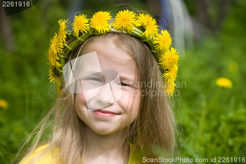 Image of little girl in yellow dandelion wreath