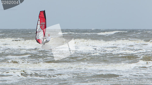 Image of Alone surfer on board in sea 