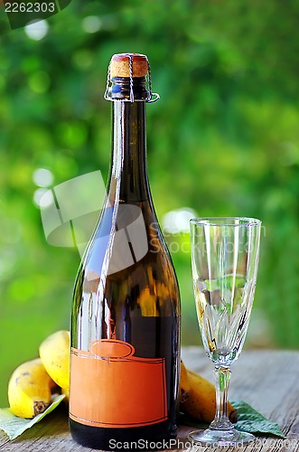 Image of Bottle of  champagne and cup