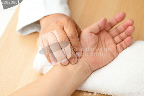 Image of Chinese doctor diagnose pulse of patient