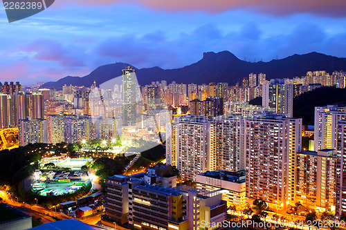 Image of Kowloon area in Hong Kong at night with lion rock