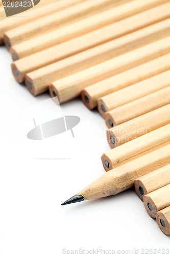 Image of Row of unused pencil with one sharpened 