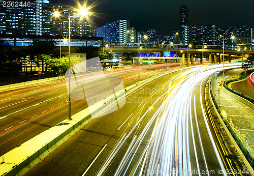 Image of Traffic light on highway at night