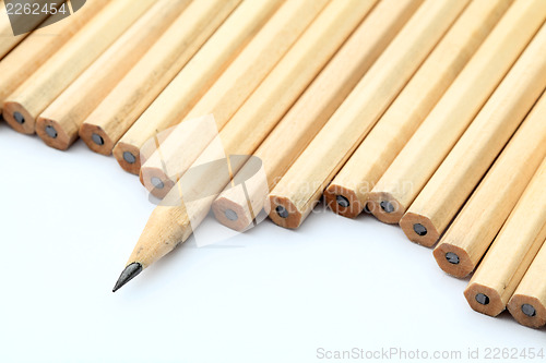 Image of Row of unused pencil with one sharpened 