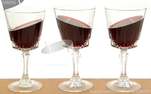 Image of Three wineglasses and gravity